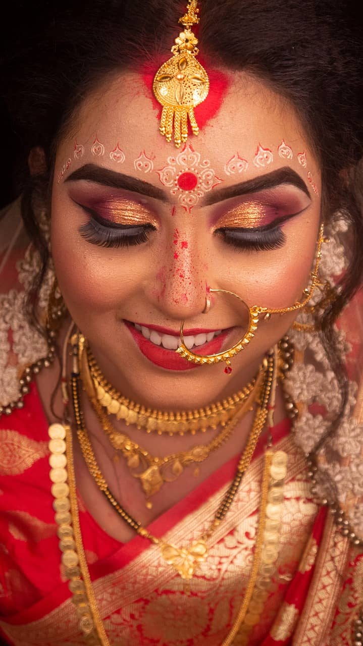 Indian woman wearing gold jewelry