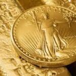 Liberty Gold Coin on Top of Bullion Bar